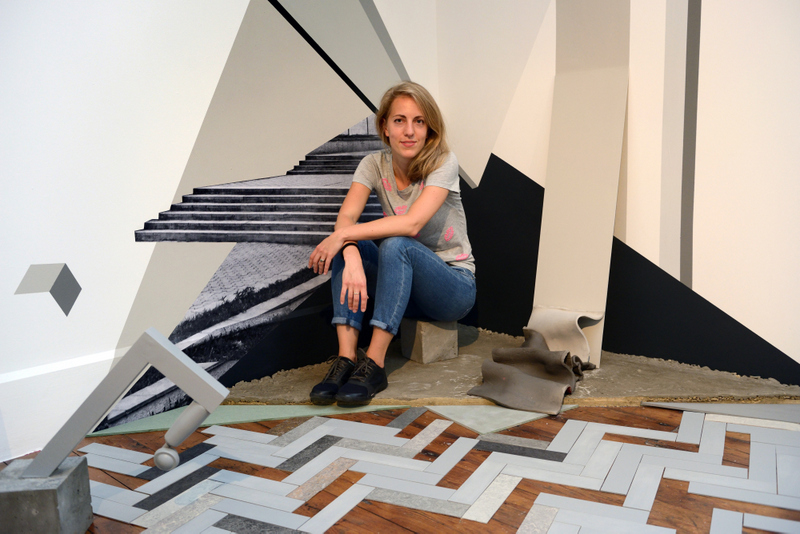 Photograph of E Jokhova at RBS 2017 in front of Sketch for failure of budgets. Photo credit Anne Purkiss-001
