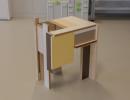 A-side-table-created-by-Mo-Abd-Ulla-from-chipboard-leftovers-that-were-given-away-by-furniture-manufacturers-free-of-charge--.jpg