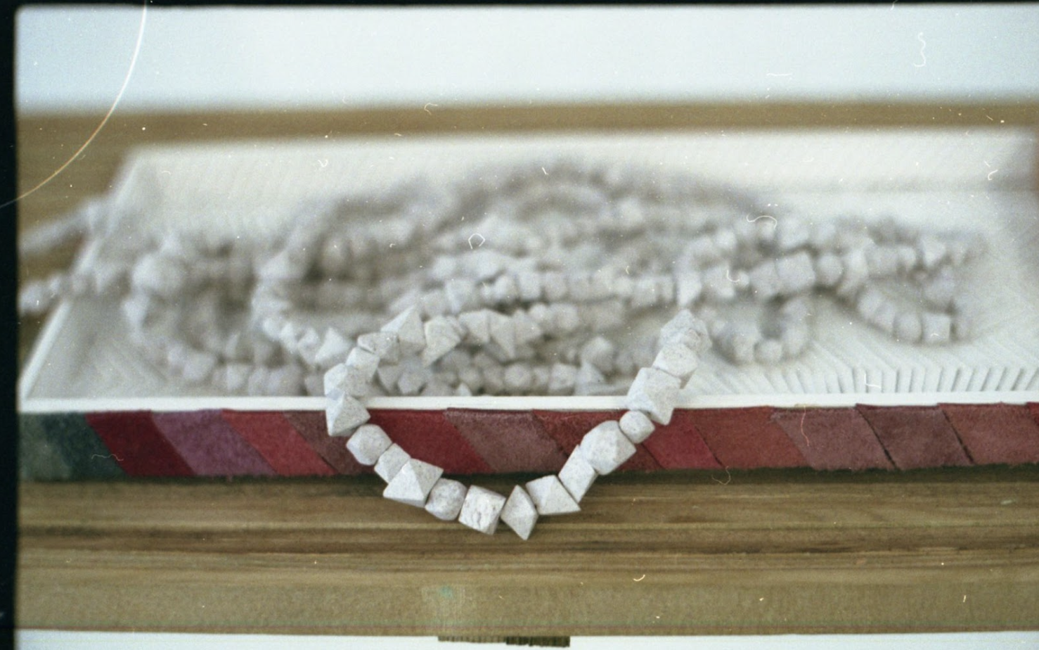 Rūta Spelskytė, Sensory device / Necklace, imperial porcelain, magnetite dust, 2022